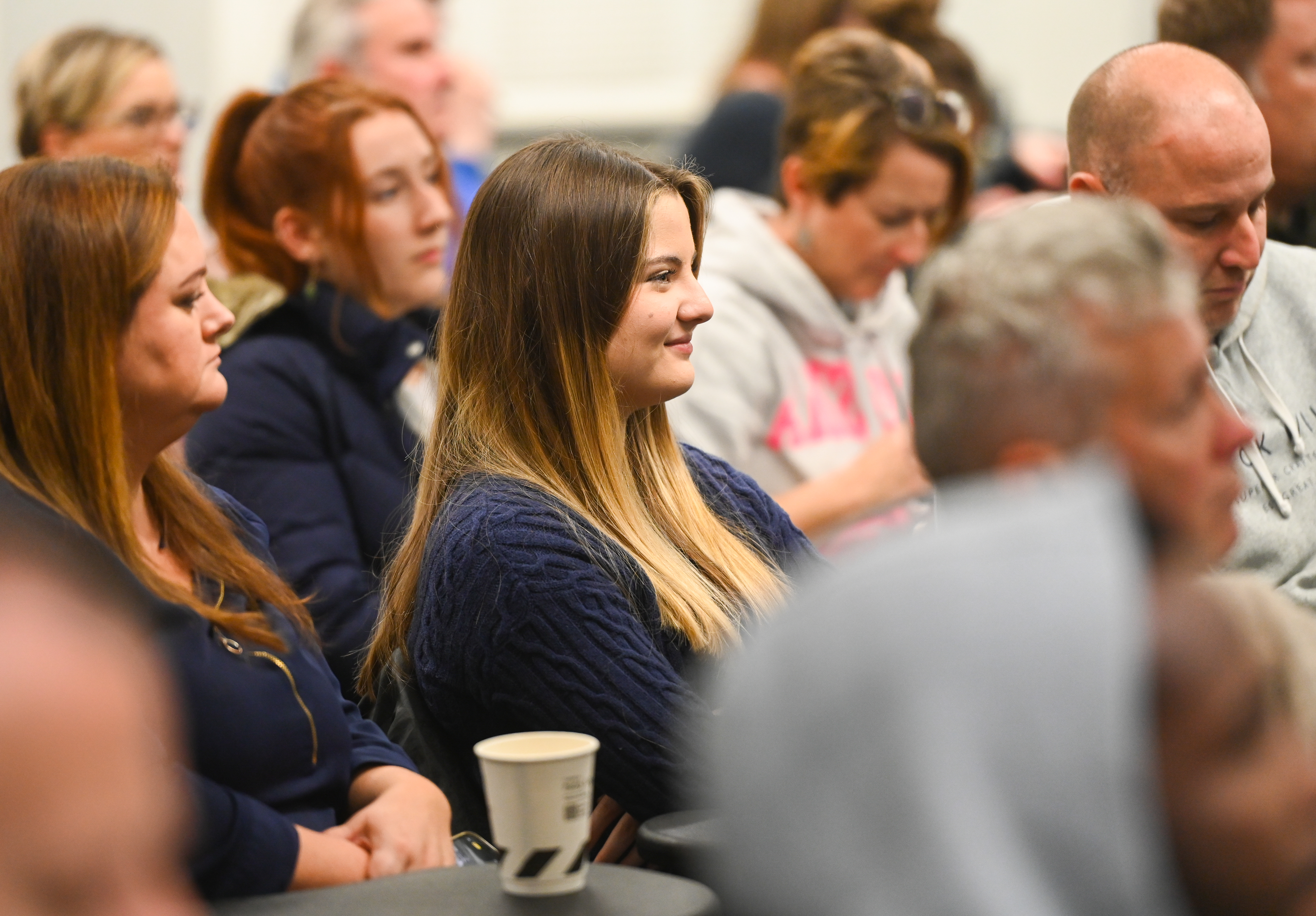 Parents and students sitting in a lecture theatre